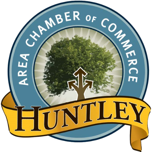 Logo for the Huntley Area Chamber of Commerce featuring a tree with arrows, a blue circular border with text, and a gold ribbon displaying Huntley.